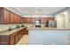Well-equipped kitchen with granite countertops and dark wood cabinets at 935 S Deerfield Ln, Gilbert, AZ 85296