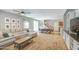 Spacious living room with ceiling fan, carpet flooring, and large sofa at 935 S Deerfield Ln, Gilbert, AZ 85296