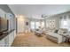 Inviting living room featuring a plush sofa and a large window at 935 S Deerfield Ln, Gilbert, AZ 85296