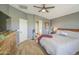 Spacious main bedroom with soft, neutral color palette and en suite bathroom at 935 S Deerfield Ln, Gilbert, AZ 85296