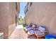 Cozy patio space with red brick pavers offers a relaxing outdoor seating area at 935 S Deerfield Ln, Gilbert, AZ 85296
