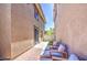 Relaxing patio featuring a gray seating set on brick pavers with privacy fence at 935 S Deerfield Ln, Gilbert, AZ 85296