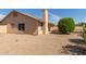 Desert landscaped backyard with a traditional ranch-style home at 9857 W Tonto Ln, Peoria, AZ 85382