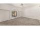 Comfortable bedroom with neutral carpet, white walls, bright windows, and spacious layout at 9857 W Tonto Ln, Peoria, AZ 85382