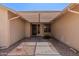 Covered entryway featuring tile flooring and neutral-toned walls offering a welcoming entrance at 9857 W Tonto Ln, Peoria, AZ 85382