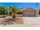 Charming single-story home featuring desert landscaping and an attached two-car garage at 9857 W Tonto Ln, Peoria, AZ 85382