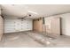 Spacious garage with storage cabinets and ample space for parking and projects at 9857 W Tonto Ln, Peoria, AZ 85382