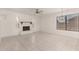 Bright living room with tile floors and a charming fireplace at 9857 W Tonto Ln, Peoria, AZ 85382