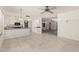Open layout with eat in kitchen area and spacious living room with tile floors at 9857 W Tonto Ln, Peoria, AZ 85382