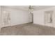 Serene main bedroom with neutral carpet, ensuite bathroom, and a private entrance at 9857 W Tonto Ln, Peoria, AZ 85382