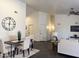 Well-lit dining area with seating for four at 10341 E Dragoon Ave, Mesa, AZ 85208