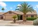 Inviting single-story home featuring desert landscaping and an attached two car garage at 10341 E Dragoon Ave, Mesa, AZ 85208
