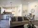 Bright living space open to a kitchen with large island and an adjacent dining area at 10341 E Dragoon Ave, Mesa, AZ 85208
