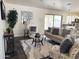 Comfortable living room with sliding glass doors providing access to backyard at 10341 E Dragoon Ave, Mesa, AZ 85208