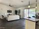 Open concept living room with stylish furniture, tile floors and sliding glass doors to the pool area at 10341 E Dragoon Ave, Mesa, AZ 85208