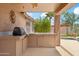 Outdoor kitchen featuring a grill and counterspace in a covered patio area at 10341 E Dragoon Ave, Mesa, AZ 85208