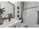 Well-lit bathroom featuring vanity, mirror, and shower-tub combo at 1111 E Peach Tree Dr, Chandler, AZ 85249