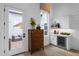 Bright main bedroom featuring a kitchenette, a stylish chest of drawers, and access to a private outdoor space at 1111 E Peach Tree Dr, Chandler, AZ 85249