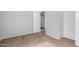 Neutral bedroom showing carpeting, closet, and an open door to the laundry area at 125 S 56Th St # 124, Mesa, AZ 85206