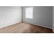 Bright bedroom featuring neutral walls, plush carpeting, and a window for natural light at 125 S 56Th St # 124, Mesa, AZ 85206