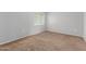 Bedroom featuring neutral carpet and a window providing natural light at 125 S 56Th St # 124, Mesa, AZ 85206