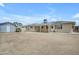 View of the home's backyard with a covered patio and detached storage shed at 1719 E Dana Ave, Mesa, AZ 85204