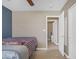 Bedroom with neutral walls, patterned bedding, and white trim at 1719 E Dana Ave, Mesa, AZ 85204