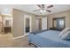 Bedroom offers tranquil ambiance with ceiling fan, dresser, and easy access to the ensuite at 1719 E Dana Ave, Mesa, AZ 85204