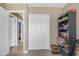 Bedroom with door, shelving, and ample storage at 1719 E Dana Ave, Mesa, AZ 85204