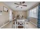 Eat in Dining room with decorative ceiling fan and wainscotting at 1719 E Dana Ave, Mesa, AZ 85204