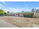 Charming single-story home with a covered front porch and a well-maintained yard in a quiet neighborhood at 1719 E Dana Ave, Mesa, AZ 85204