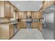 Well-equipped kitchen with stainless steel appliances, light wood cabinetry, and ample countertop space at 1719 E Dana Ave, Mesa, AZ 85204