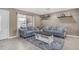 Inviting living room with neutral tones, comfortable sofas, and a rustic coffee table for a cozy atmosphere at 1719 E Dana Ave, Mesa, AZ 85204
