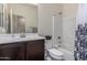 Bathroom features a shower-tub combination, a vanity with cabinets, and modern fixtures at 17296 W Molly Ln, Surprise, AZ 85387