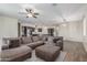 Spacious living room seamlessly blends with the kitchen, creating an inviting open floor plan at 17296 W Molly Ln, Surprise, AZ 85387