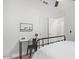 Bedroom features a black metal bed frame, work desk, and a ceiling fan at 17827 N 51St Way, Scottsdale, AZ 85254