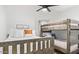 Cozy bedroom with a rustic wooden bunk bed and single bed with white bedding at 17827 N 51St Way, Scottsdale, AZ 85254