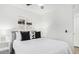 Bright bedroom features a queen bed with white bedding and modern black pillows at 17827 N 51St Way, Scottsdale, AZ 85254