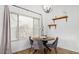 Cozy dining area with a window, comfortable seating, and decorative shelving at 17827 N 51St Way, Scottsdale, AZ 85254