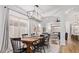Bright dining area with modern chandelier, seating for six, and natural light streaming in at 17827 N 51St Way, Scottsdale, AZ 85254