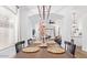 Charming dining room with wood table and seating, seamlessly connected to the open floor plan at 17827 N 51St Way, Scottsdale, AZ 85254