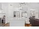 Open-concept kitchen with a large island, stainless steel appliances, and white cabinetry at 17827 N 51St Way, Scottsdale, AZ 85254