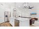 Bright kitchen featuring white cabinets, stainless steel appliances, and modern lighting fixtures at 17827 N 51St Way, Scottsdale, AZ 85254