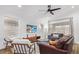 Cozy living room with ceiling fan, comfortable seating, and large windows for natural light at 17827 N 51St Way, Scottsdale, AZ 85254