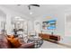 Inviting living room featuring modern decor, ceiling fan, and a large flat-screen television at 17827 N 51St Way, Scottsdale, AZ 85254