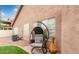 Back patio with stylish hanging chair and desert landscaping at 17827 N 51St Way, Scottsdale, AZ 85254