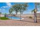 Fenced pool area with desert landscaping and shade trees at 17827 N 51St Way, Scottsdale, AZ 85254
