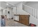 Hallway with custom sliding barn door and convenient stairway access to the upper level at 17935 W Louise Dr, Surprise, AZ 85387
