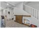 Hallway with custom sliding barn door and convenient stairway access to the upper level at 17935 W Louise Dr, Surprise, AZ 85387