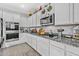 Kitchen featuring granite countertops, stainless steel appliances, and gray walls at 17935 W Louise Dr, Surprise, AZ 85387